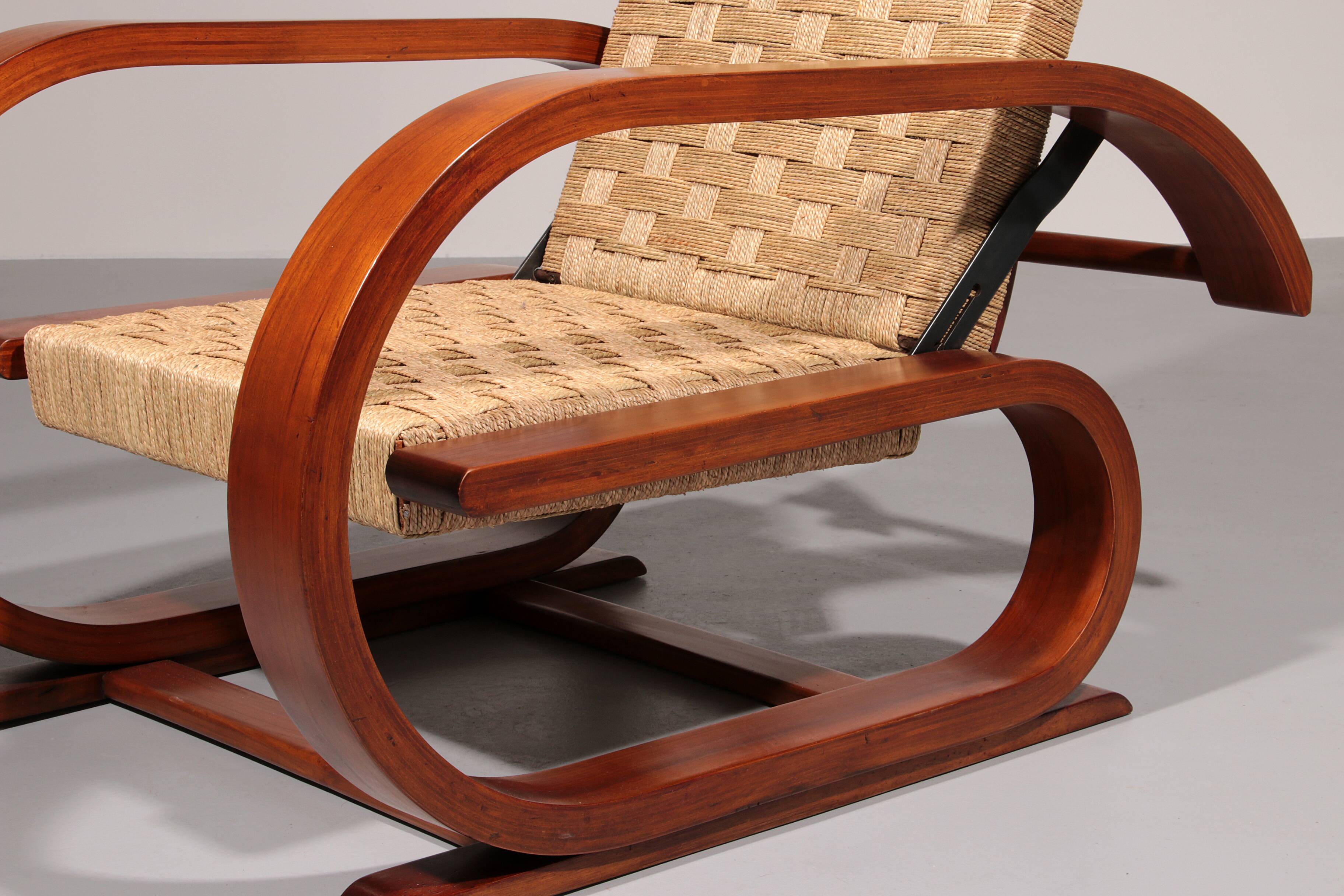 An exceptionally rare mahogany recliner crafted in Italy during the 1950s"
