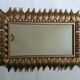 Vintage gold metal mirror with leaves from the 1950s.