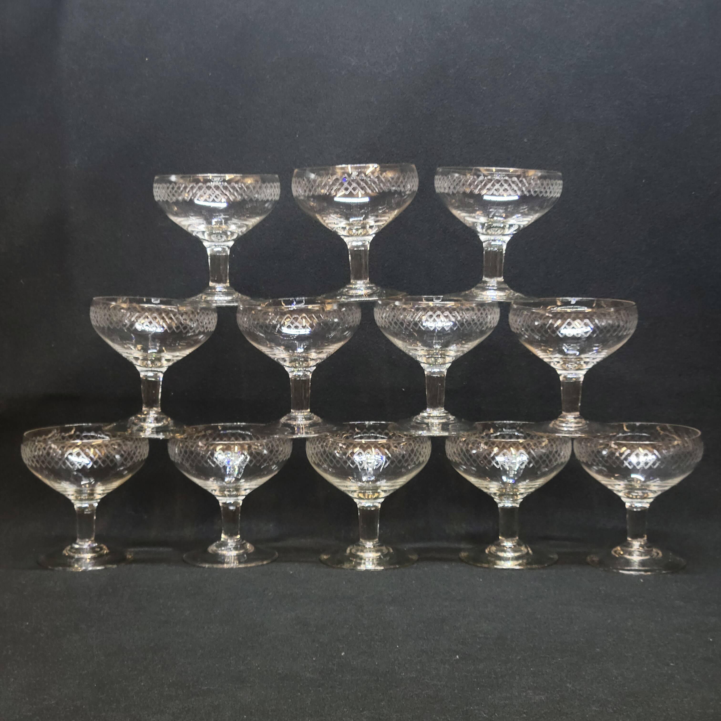 12 old champagne glasses in blown and engraved glass