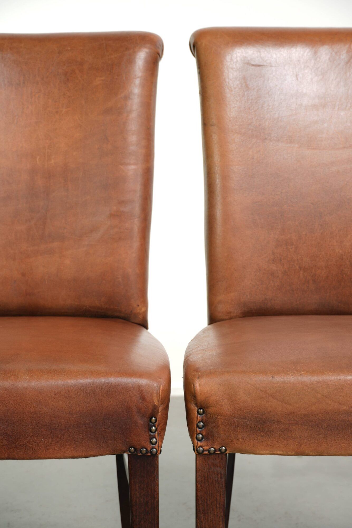 Set of 6 sheepskin dining chairs in a cognac colour with a lovely patina