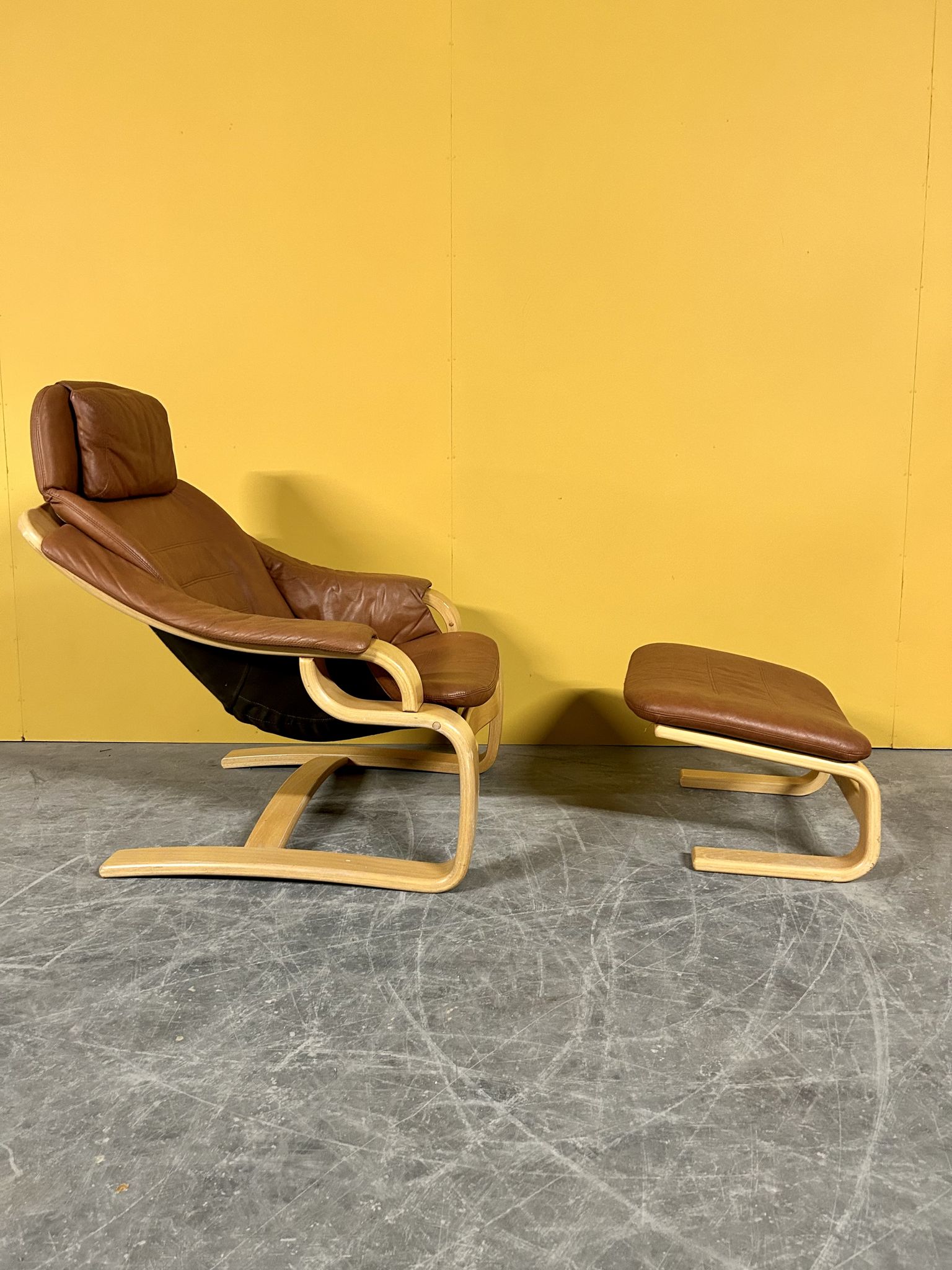 Danish vintage cognac leather armchair and footstool by Skipper Mobler
