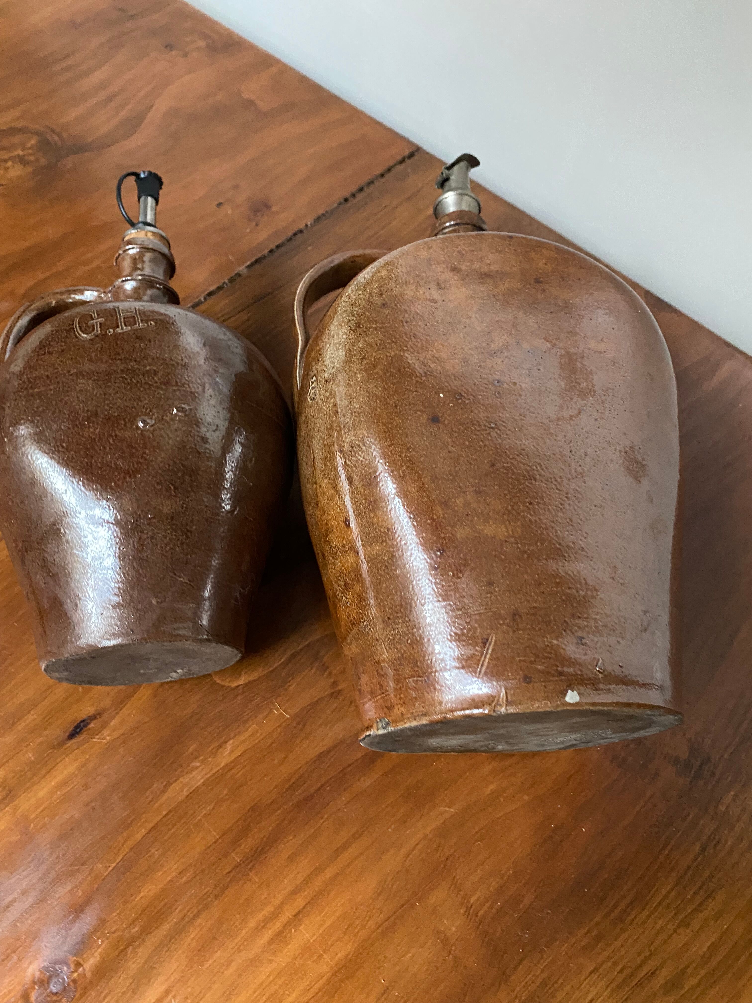 Pair of bottles in sandstone