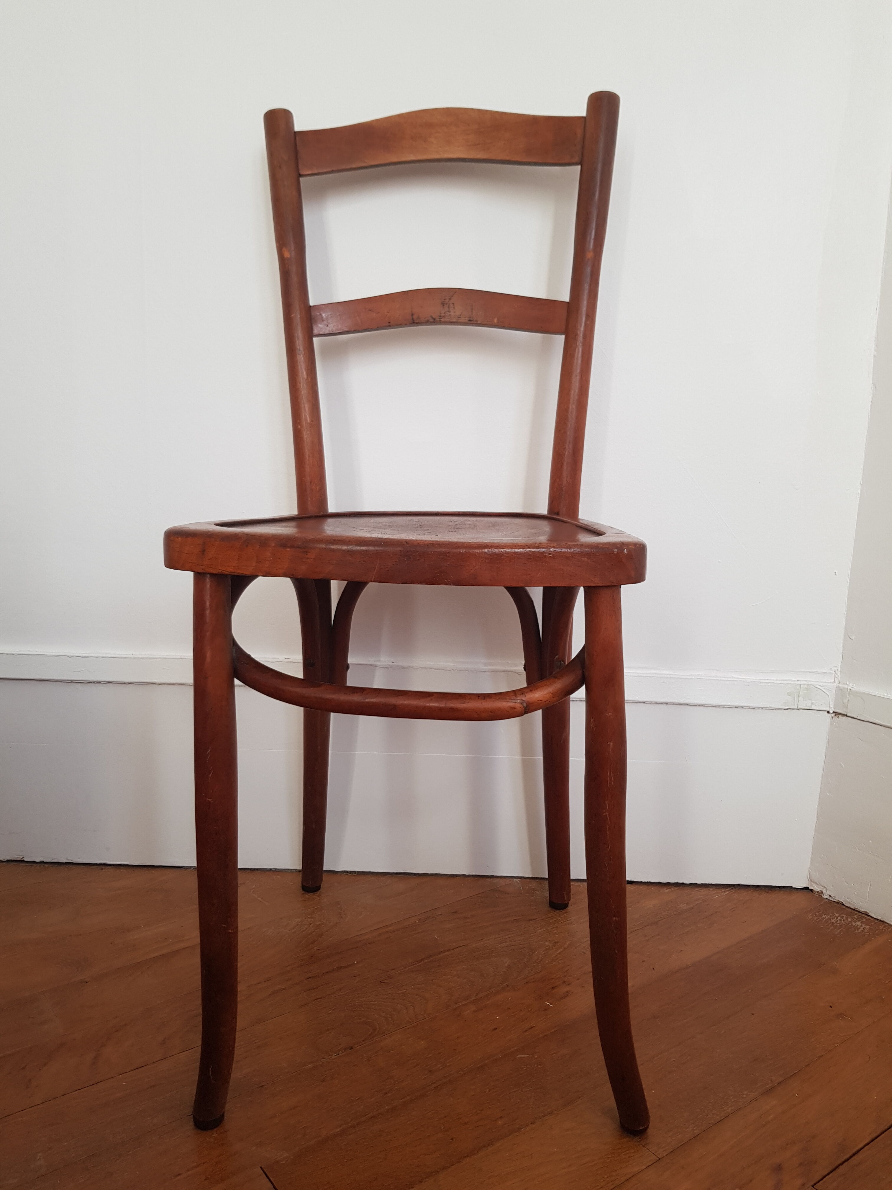 Curved wooden bistro chair