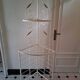 Cream and brass corner bakery shelf in wrought iron