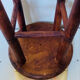 Vintage four-legged stool made of solid wood from the 1970s/80s.