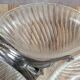 Vintage glass serving tray with silver-plated handle.