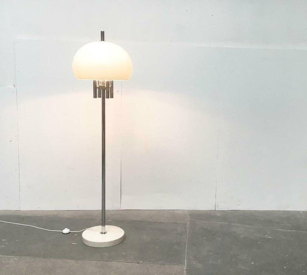 Italian space-style floor lamp from the 1960s with a stone base.