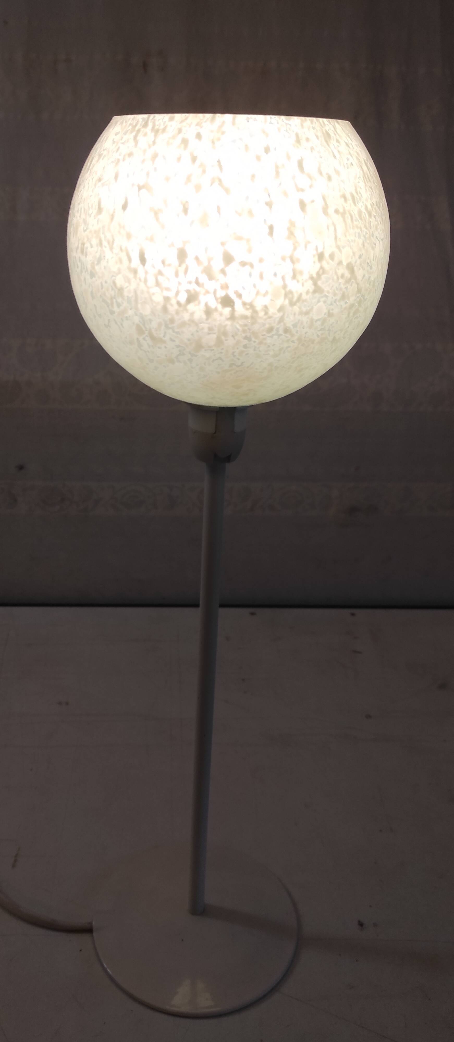 Table lamp with a pale green Clichy glass globe.