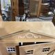 Large wooden dollhouse with miniature furniture