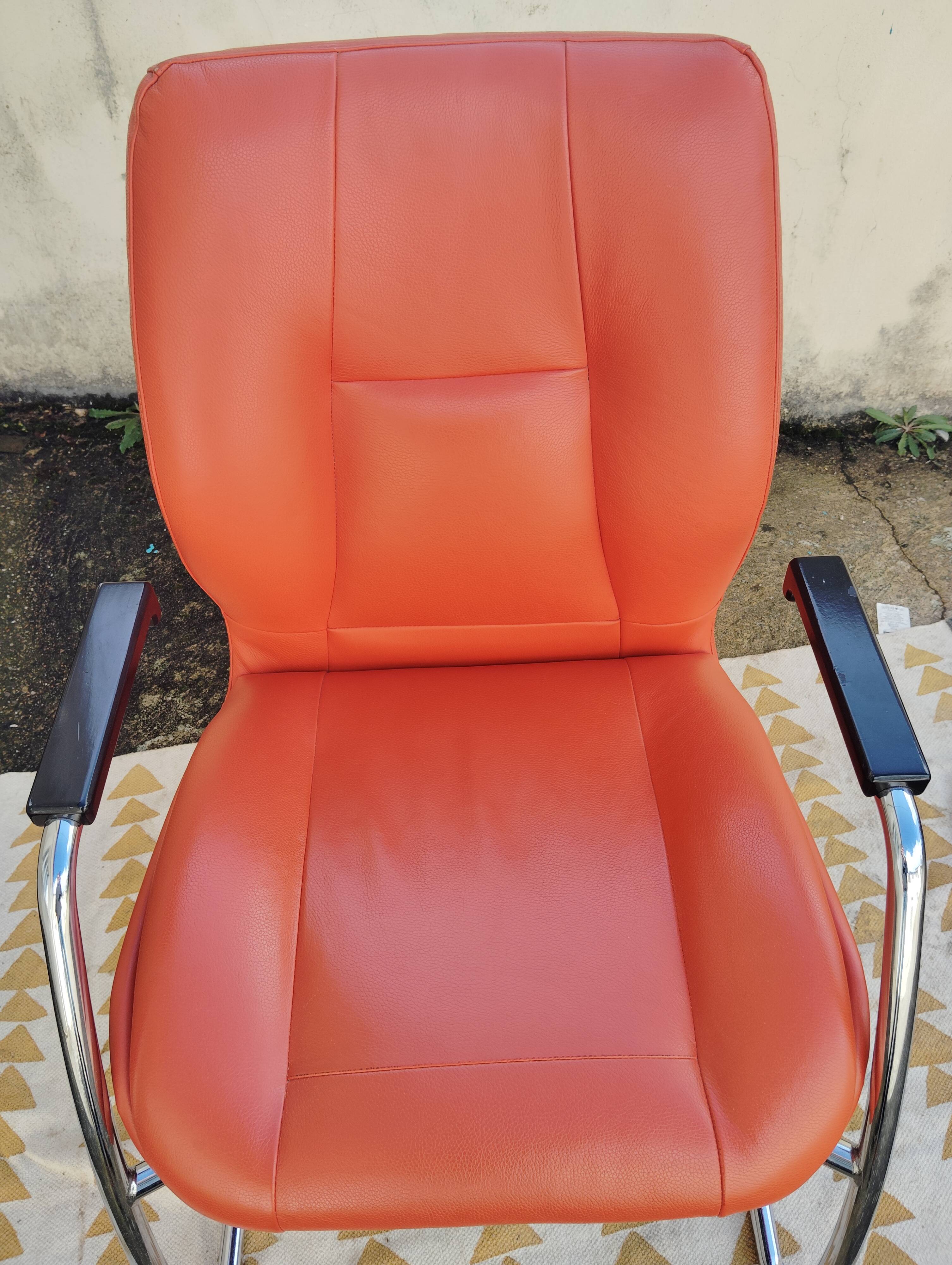 Orange leather cantilever tubular armchair