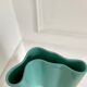 Blue-green ceramic vase
