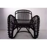 Rattan armchair and matching footstool