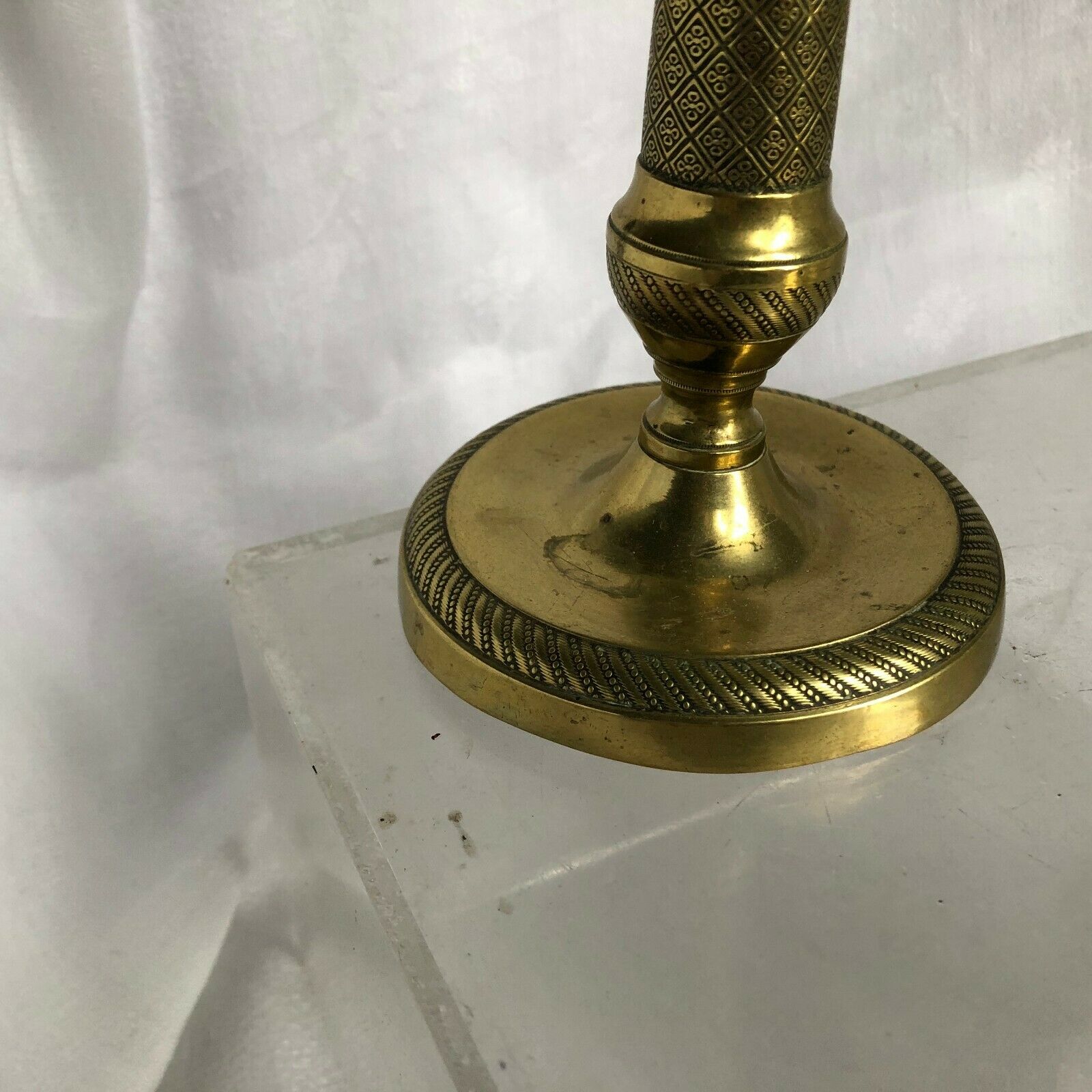 Pair of bronze and brass candlesticks