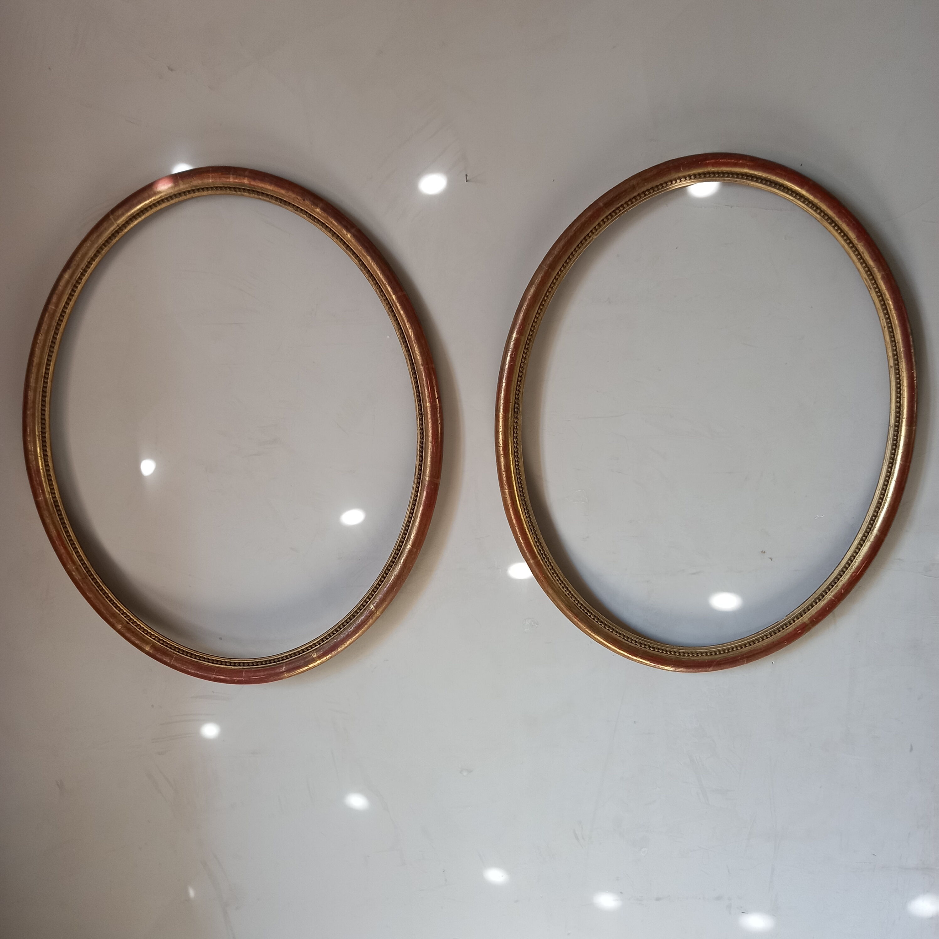 Pair of oval gilded frames Louis XVI style