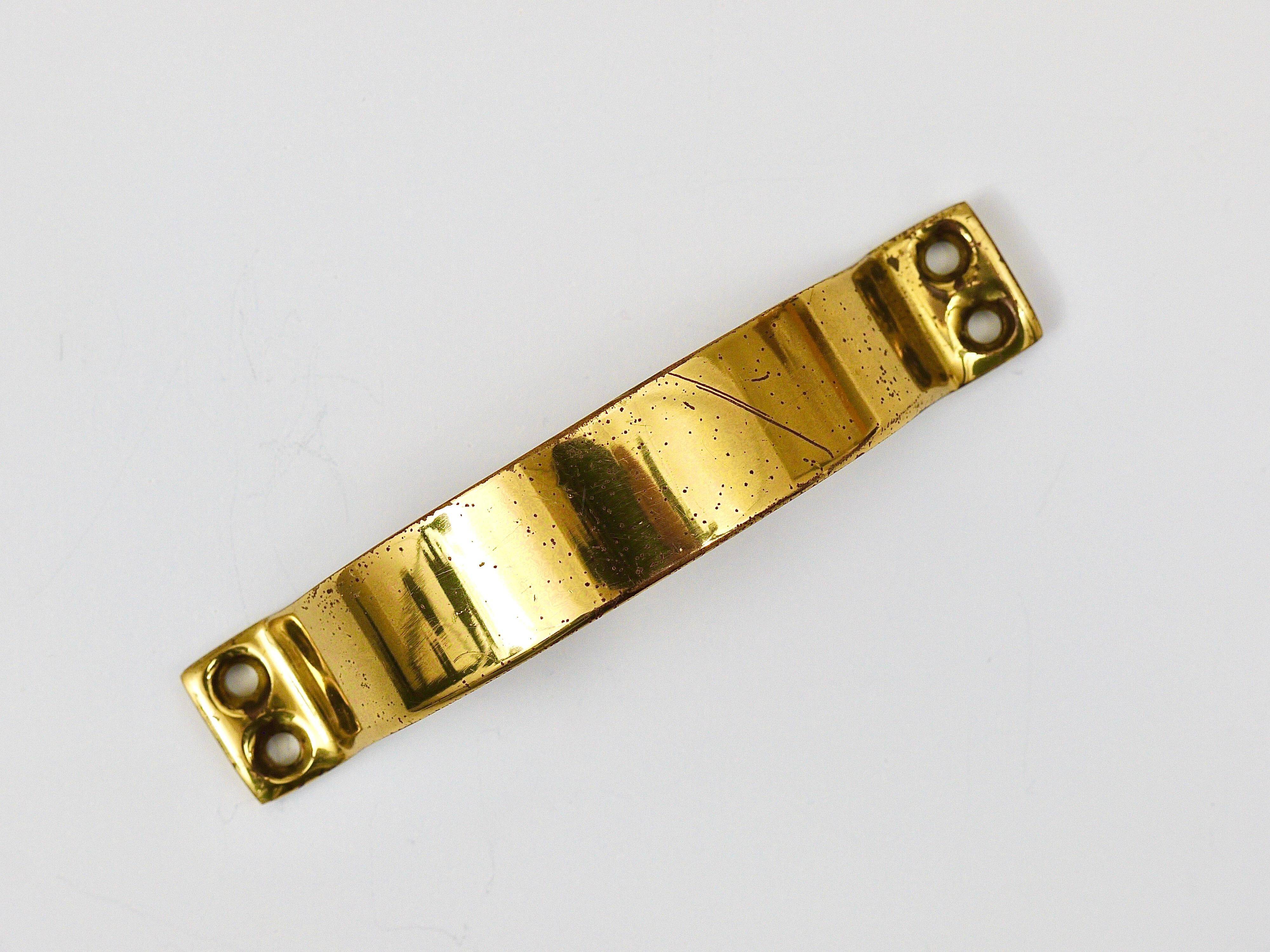 Up to 50 mid-century brass handles for doors, drawers, chests of drawers, Austria, 1950s.