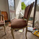 Louis XV style chair in patinated wood, fully upholstered in a fabric.