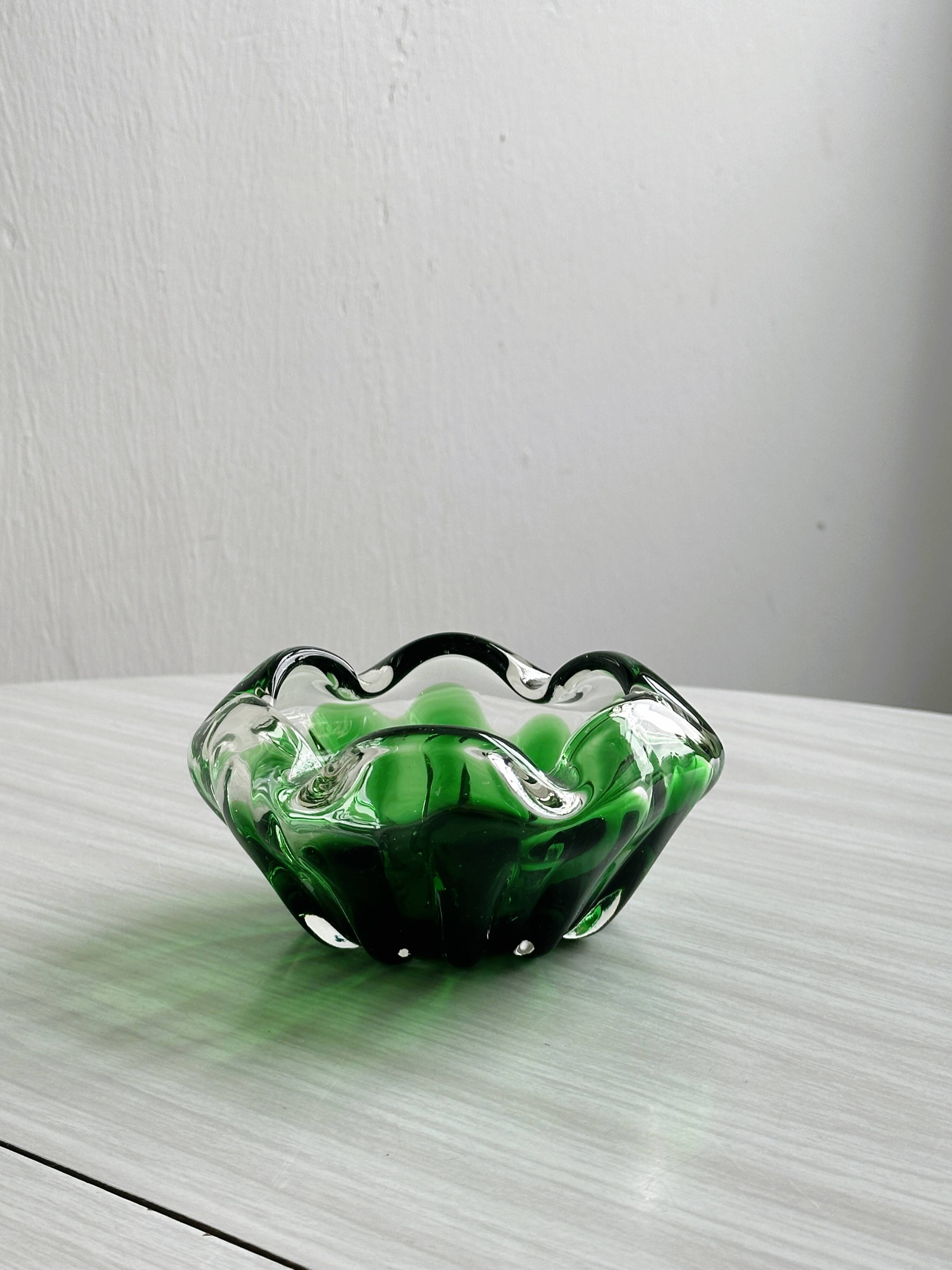 Translucent green ashtray.