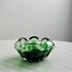 Translucent green ashtray.
