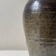 Brown-black glazed stoneware vase, signed underneath the base, circa 1950.