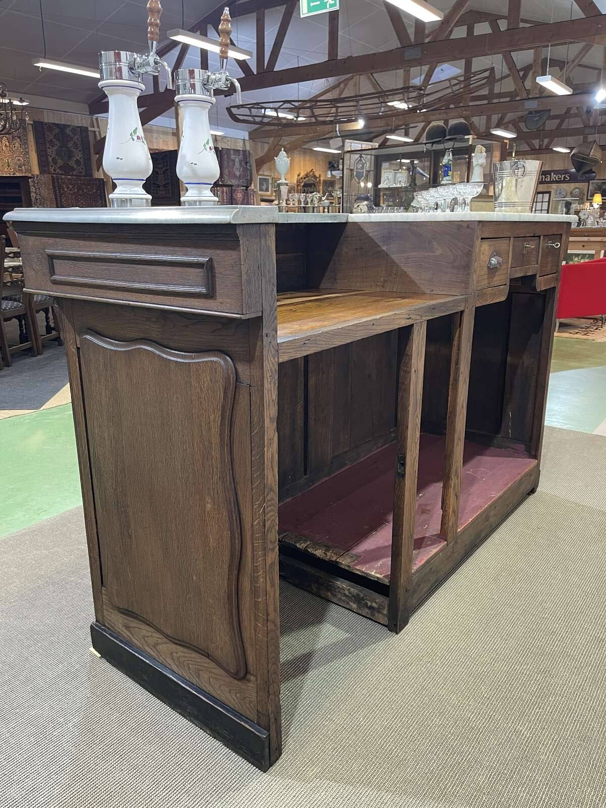 Bar counter in oak, zinc, and white marble from the early 20th century.