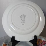 7 flowered dessert plates, St Amand factory, 1930