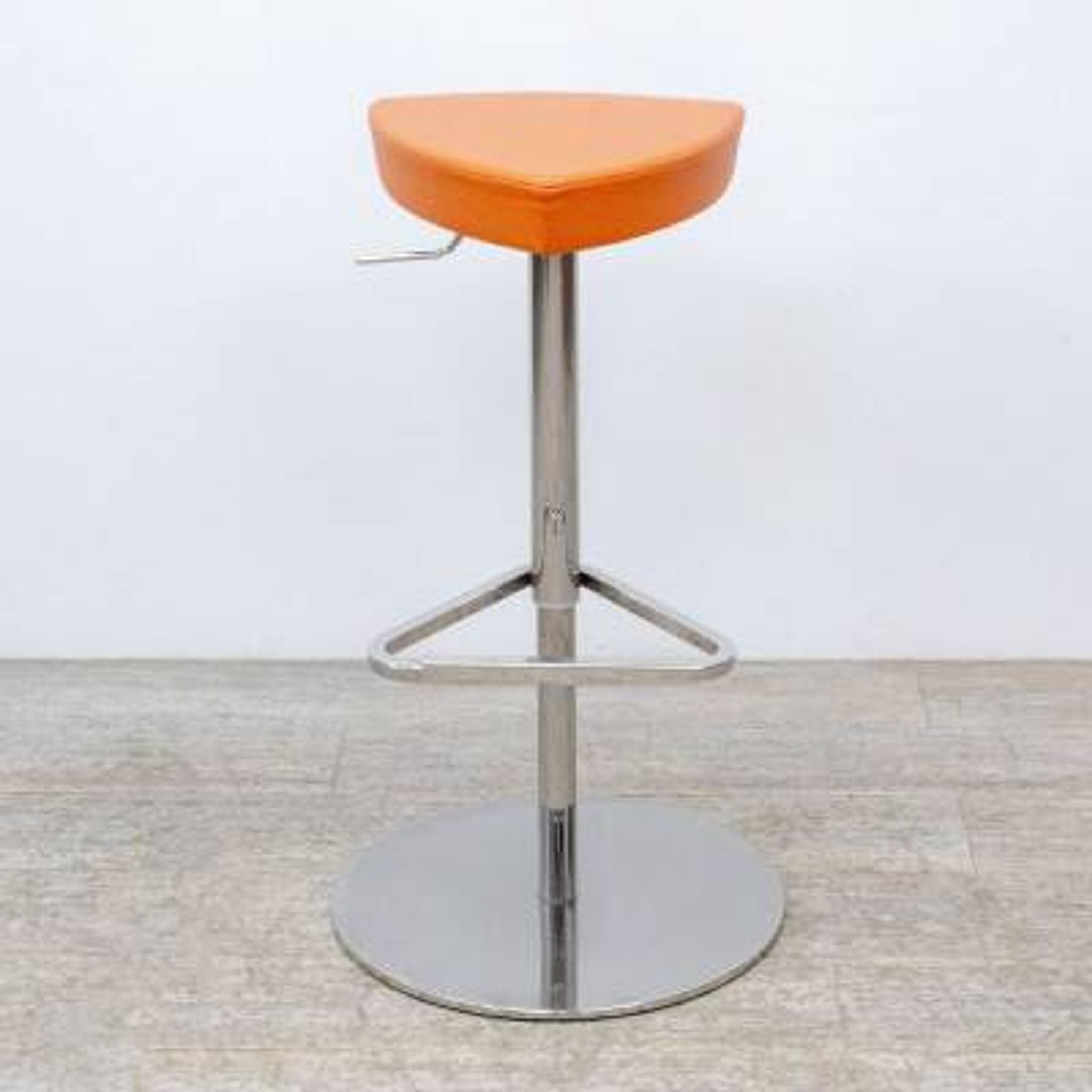 Adjustable orange swivel bar stool