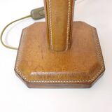Lamp base in saddle stitched leather and raffia lampshade.