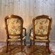 Pair of Louis XV style armchairs with floral fabric.