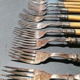 Old silver fish forks with bone handles
