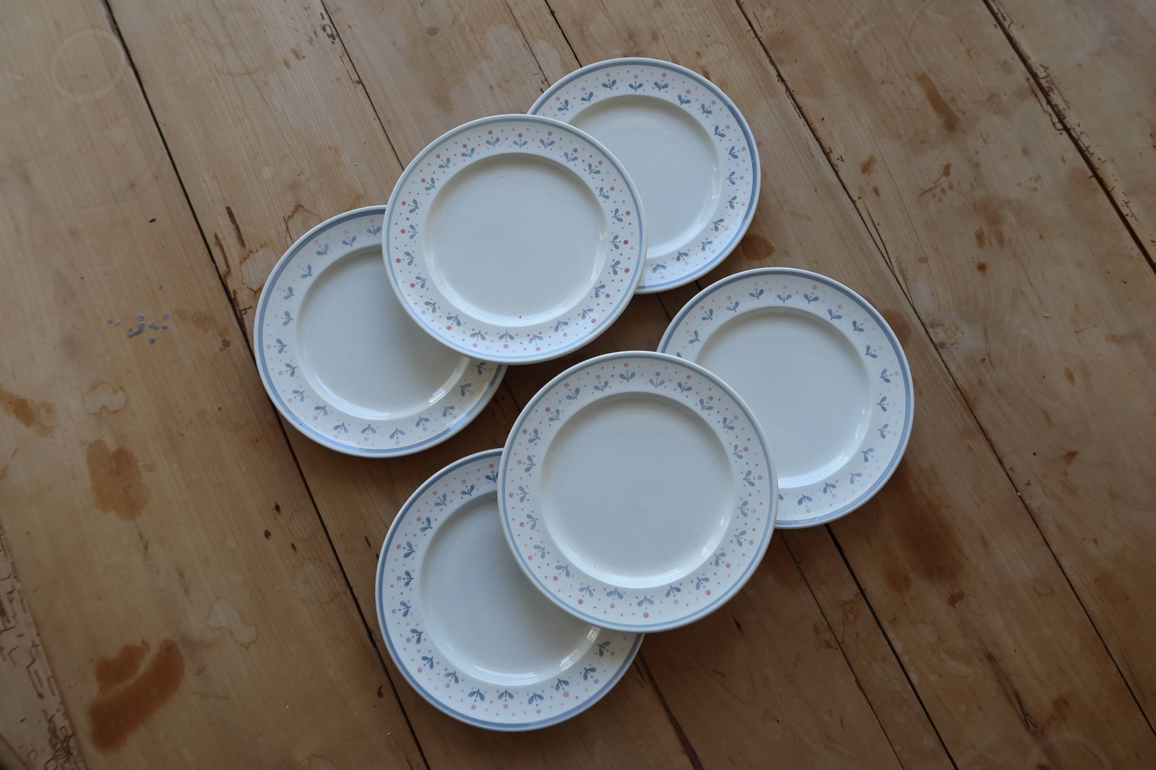 6 vintage dessert plates stamped Longchamp with floral border
