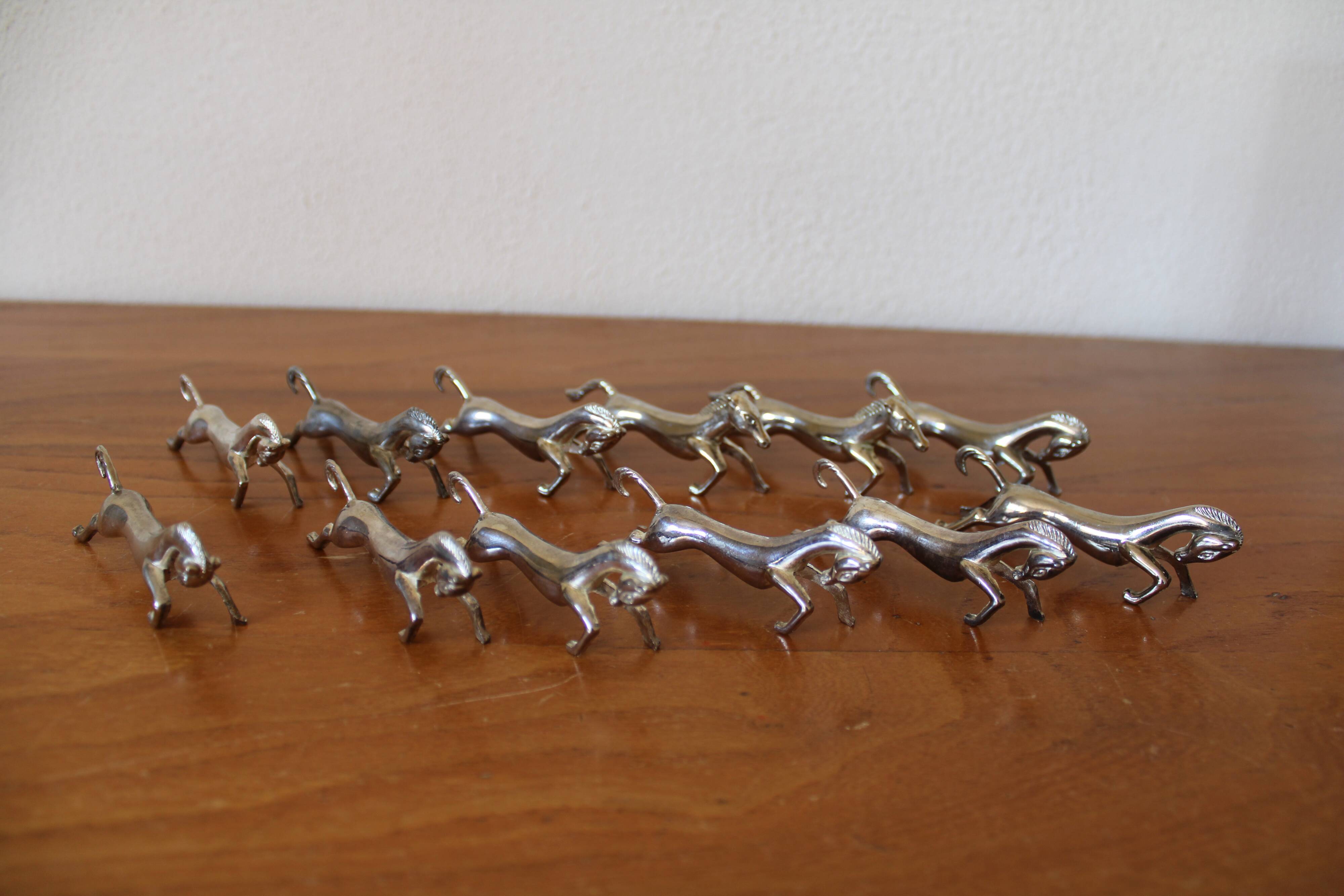 Set of 12 vintage knife rests, in silver metal