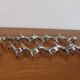 Set of 12 vintage knife rests, in silver metal