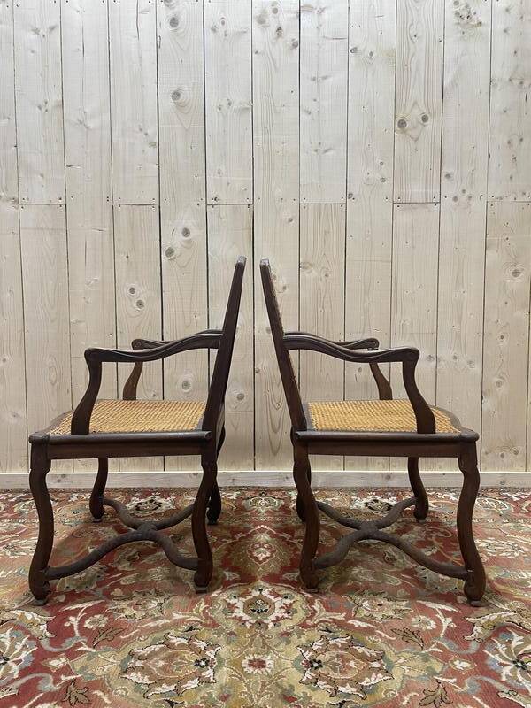 Paire de fauteuils de style Louis XIII os de mouton en cannage.