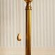 "Pique candle" double fire floor lamp in gilded bronze
