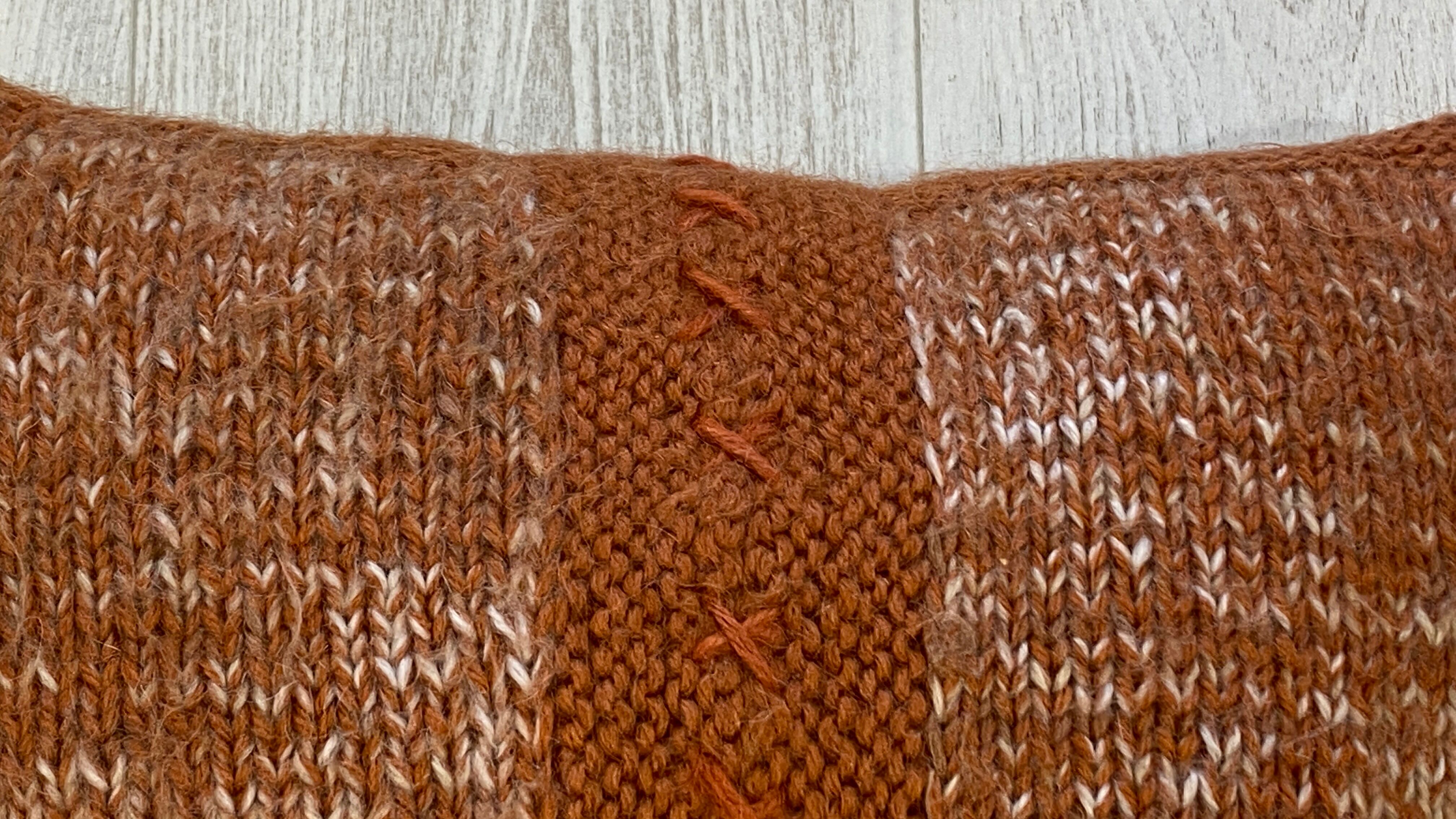 Pair of retro terracotta wool knit cushions