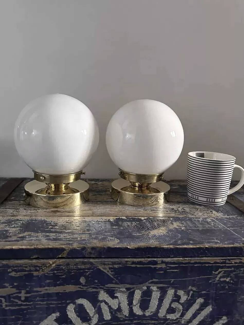 Pair of white opaline globe wall lights