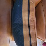 Leather club armchair and its pouf