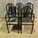 Two vintage slatted chairs.