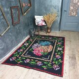 Vintage wool rug with floral design in sweet colors