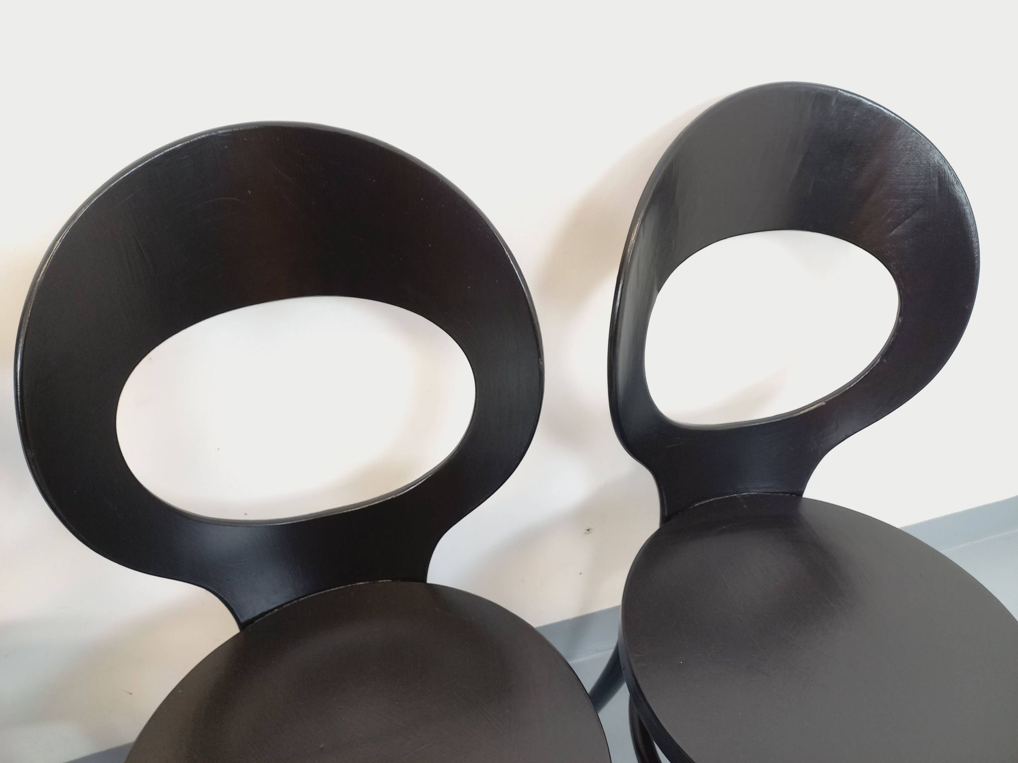 Set of 4 vintage Mouette chairs by Baumann in black wood from the 1960s.