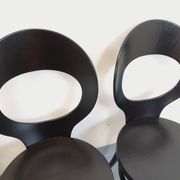 Set of 4 vintage Mouette chairs by Baumann in black wood from the 1960s.