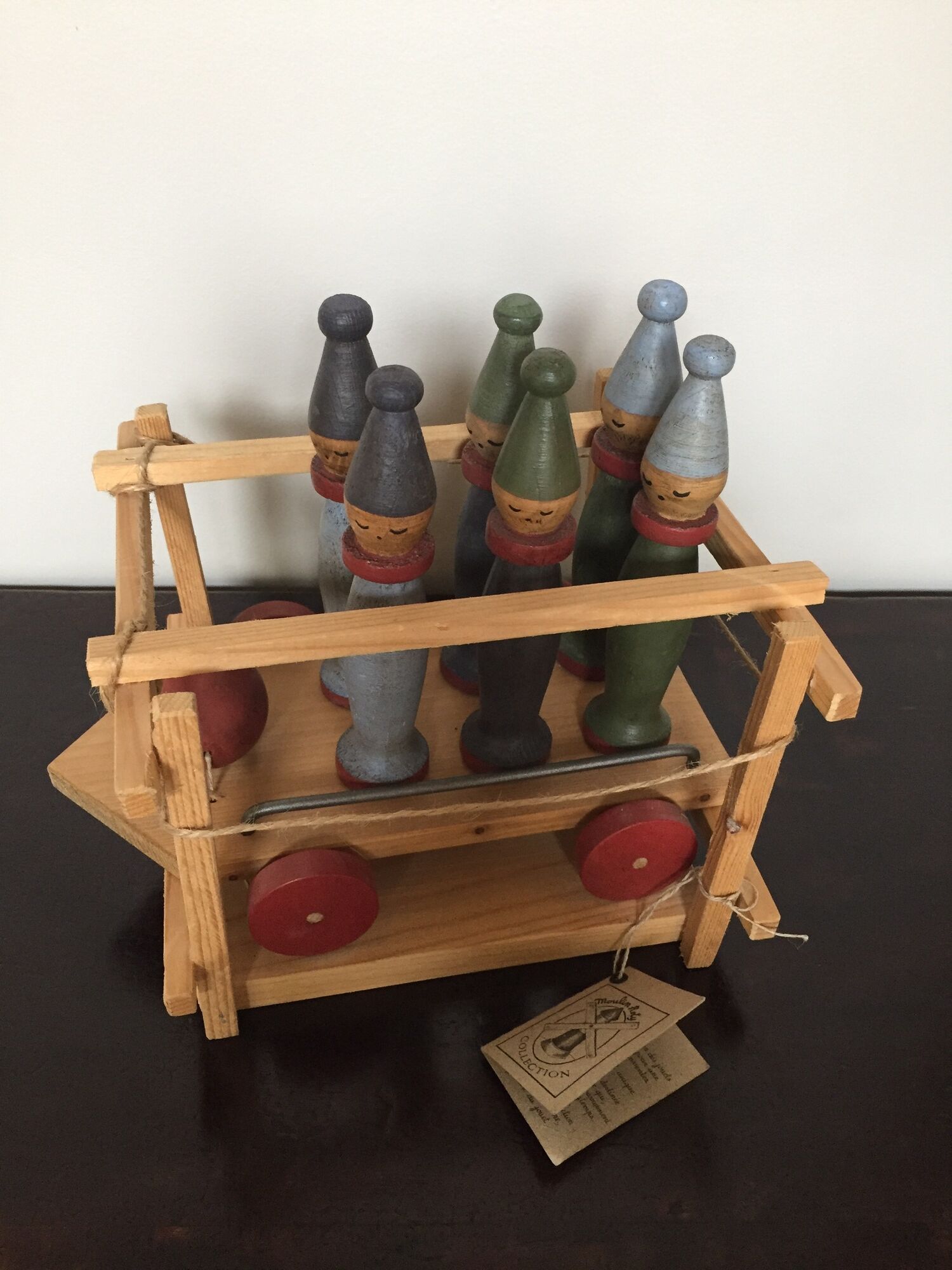 Set of Moulin Roty brand wooden bowling on roller cart, limited series.