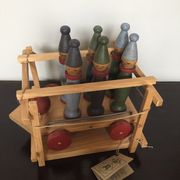 Set of Moulin Roty brand wooden bowling on roller cart, limited series.