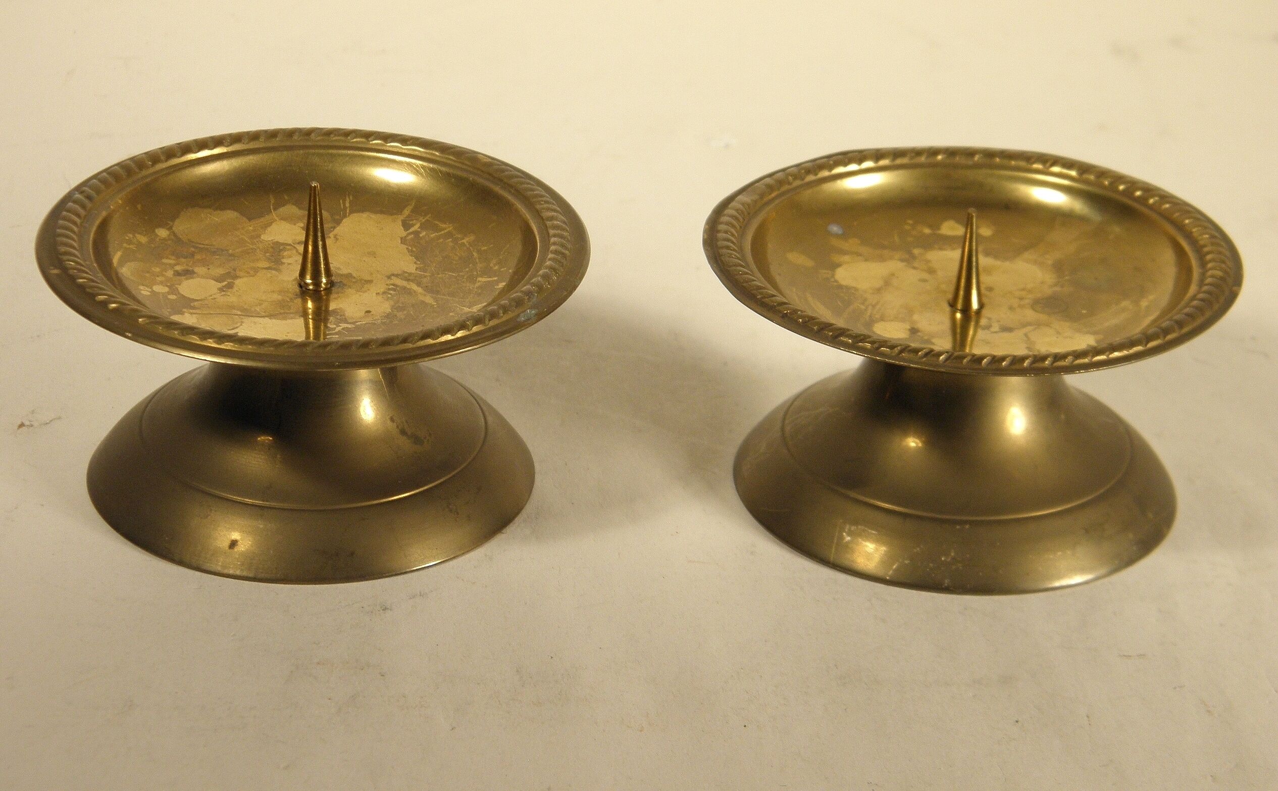 Pair of brass "pique - candle" candlesticks