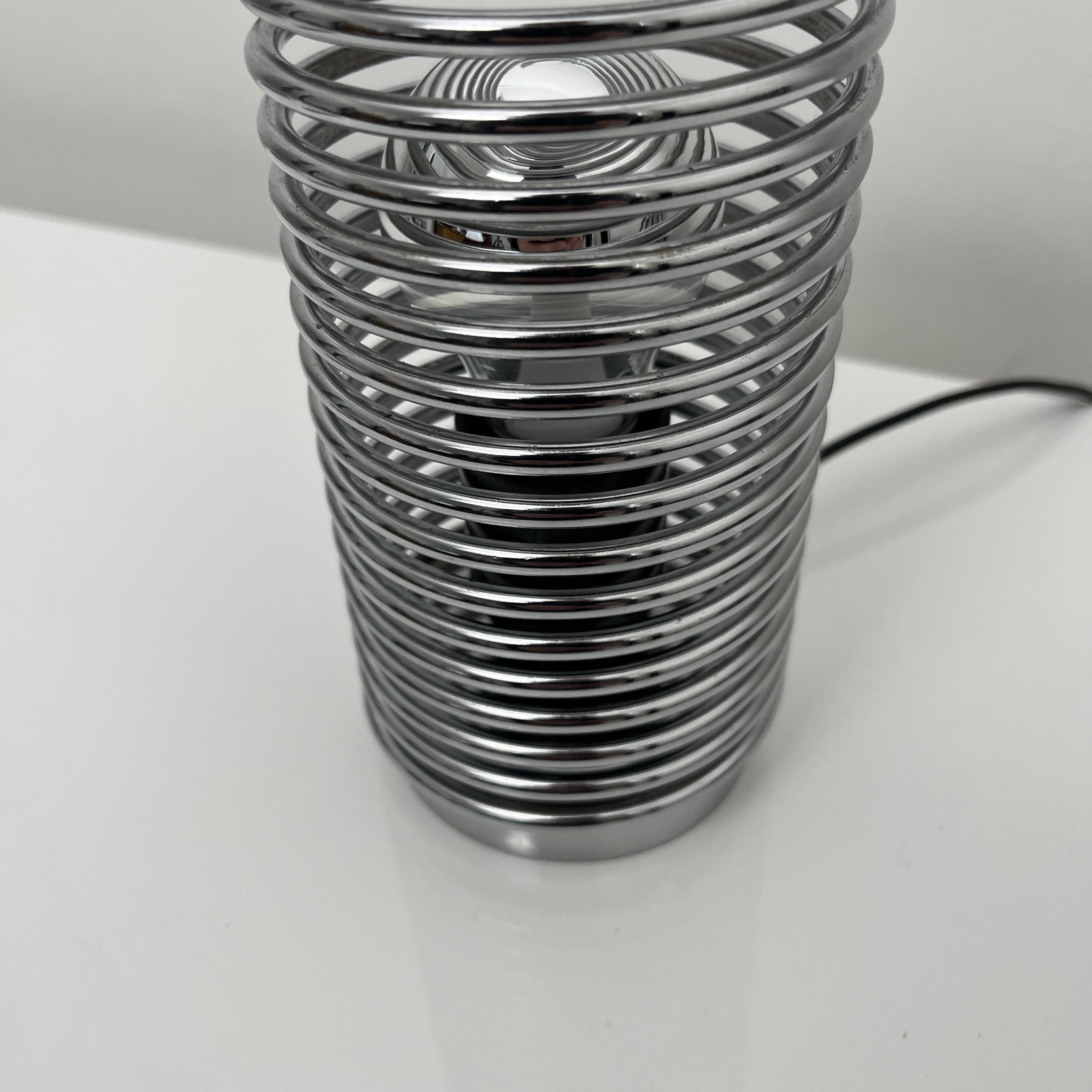 Massive chrome spring lamp