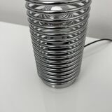 Massive chrome spring lamp
