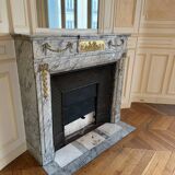 Louis XVI fireplace in veined grey marble with original gilded bronzes from the 19th century.