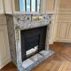 Louis XVI fireplace in veined grey marble with original gilded bronzes from the 19th century.