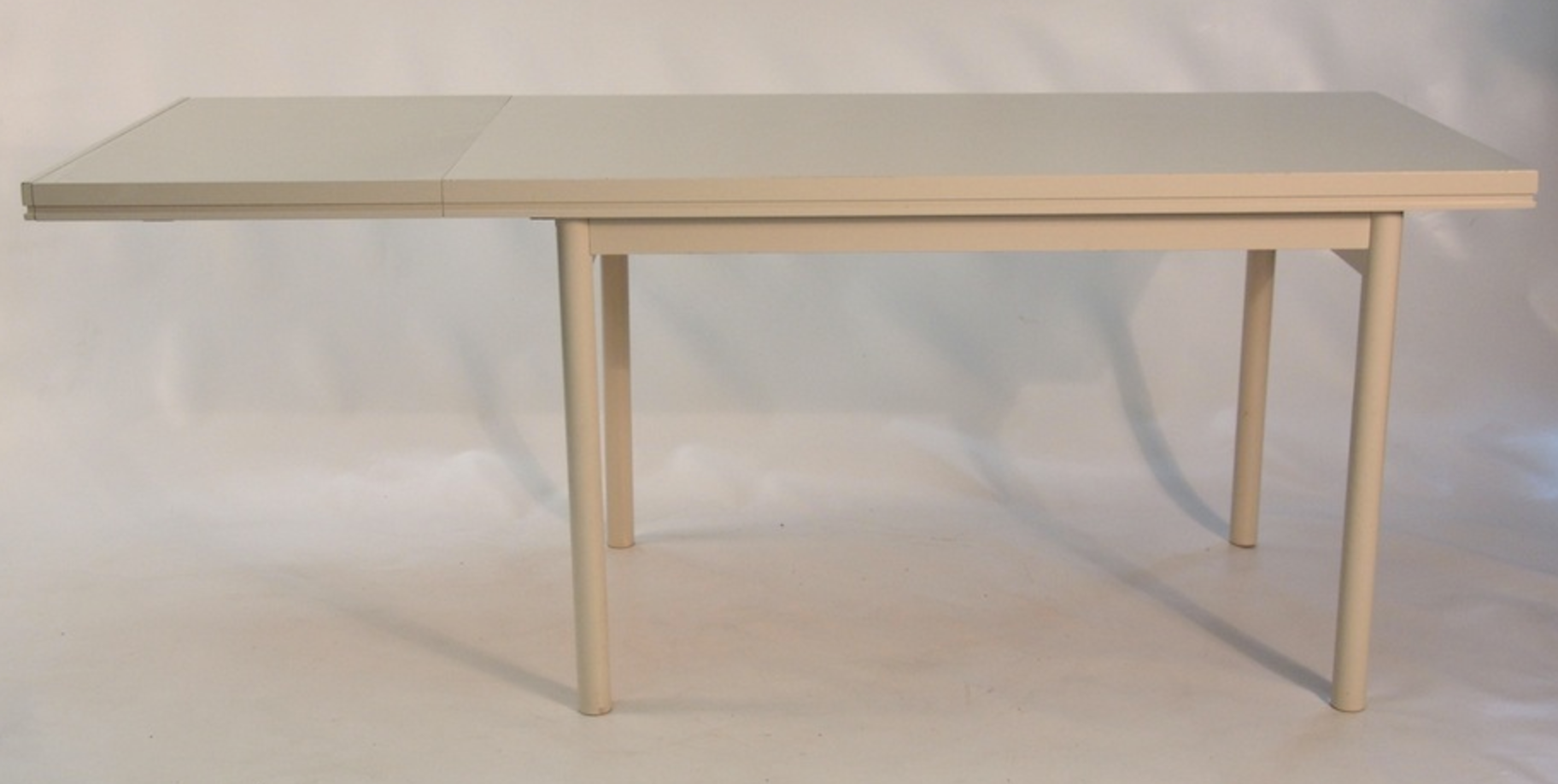 Beige extendable wooden table