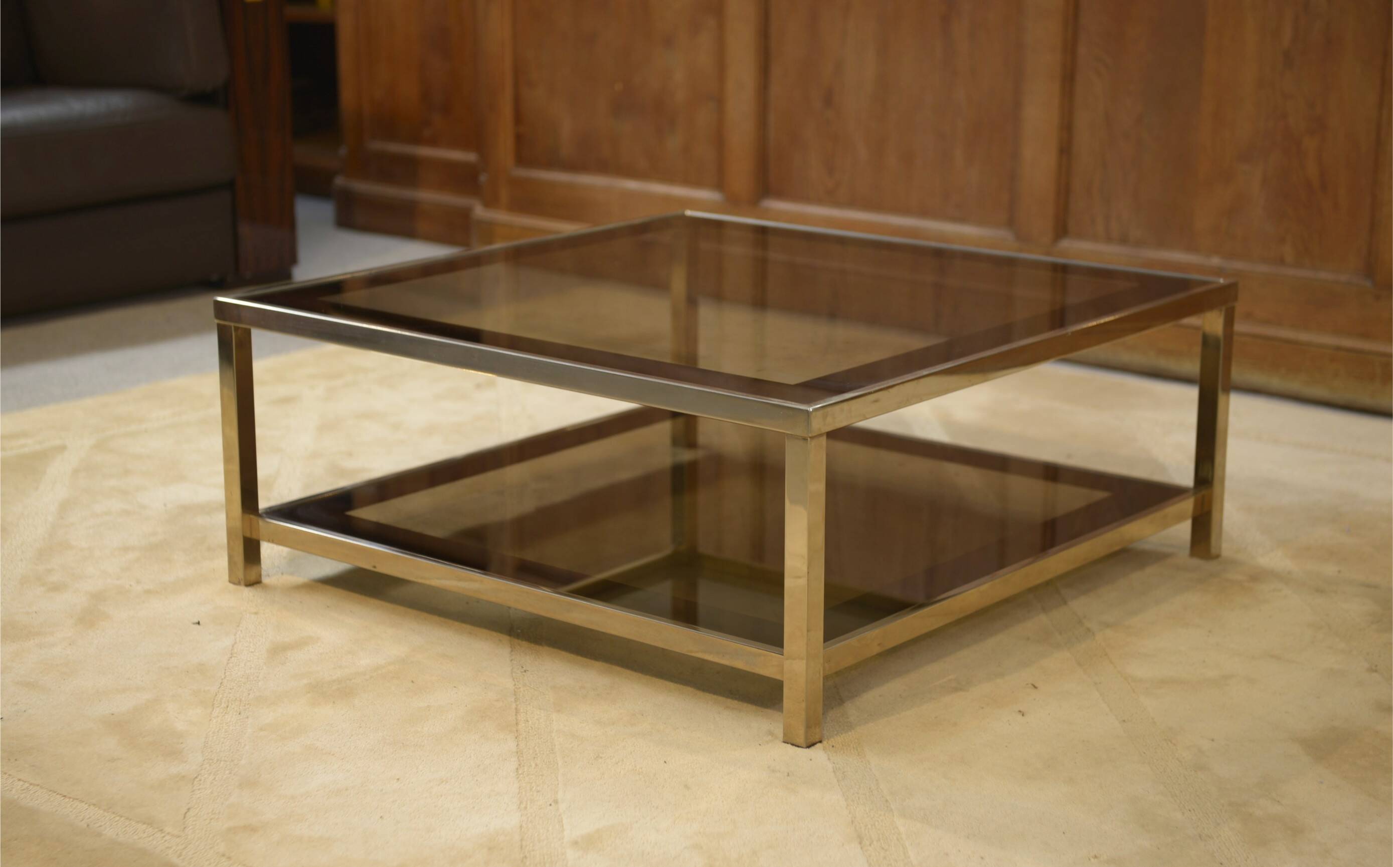 Hollywood Regency coffee table in smoked glass with mirrored framing from the 1970s.